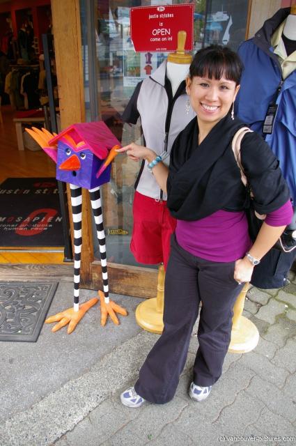 Joann and a cartoon sculpture at Granville Island in Vancouver.jpg