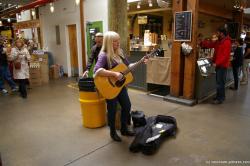 Woman guitar player in the Granville Island Market in Vancouver.jpg